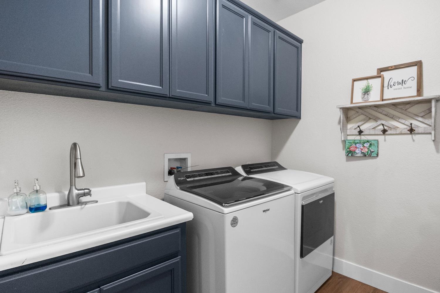 637 Rebekah Court Ripon, CA 95366 - Photo 28 of 69 a kitchen with stainless steel appliances granite countertop a sink stove and cabinets