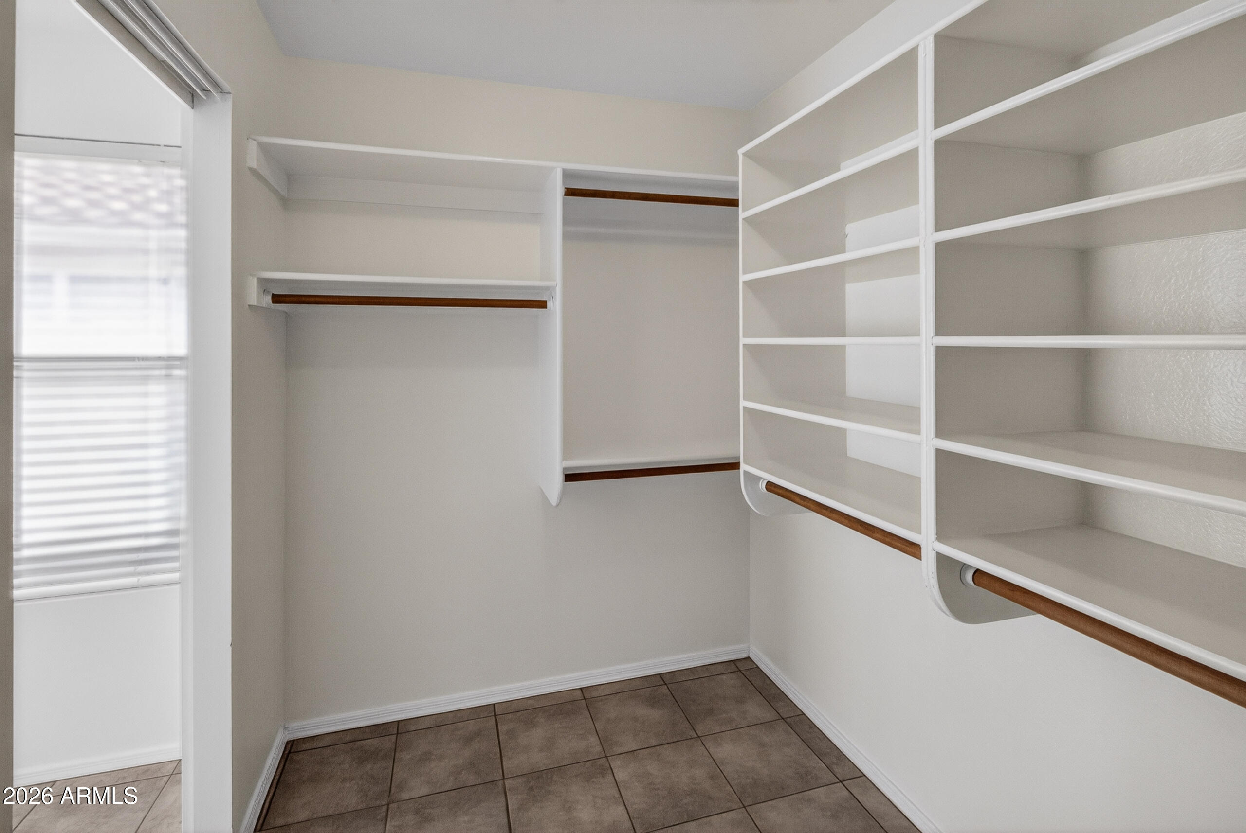 8916 West Davis Road Peoria, AZ 85382 - Photo 12 of 34 Primary bedroom walk in closet