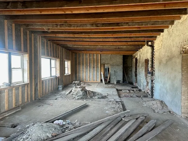 a view of a hallway with windows