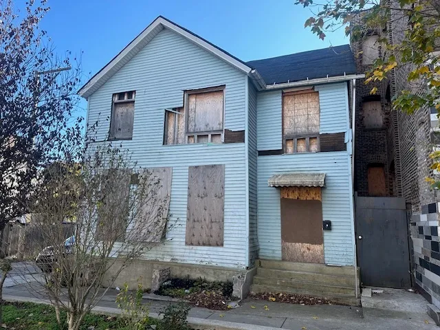 a front view of a house with stairs