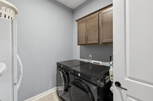 a view of a storage and utility room with a sink