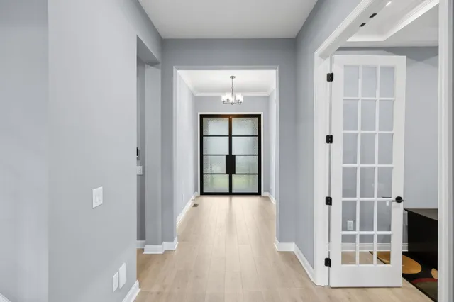 wooden floor in a gallery with front door