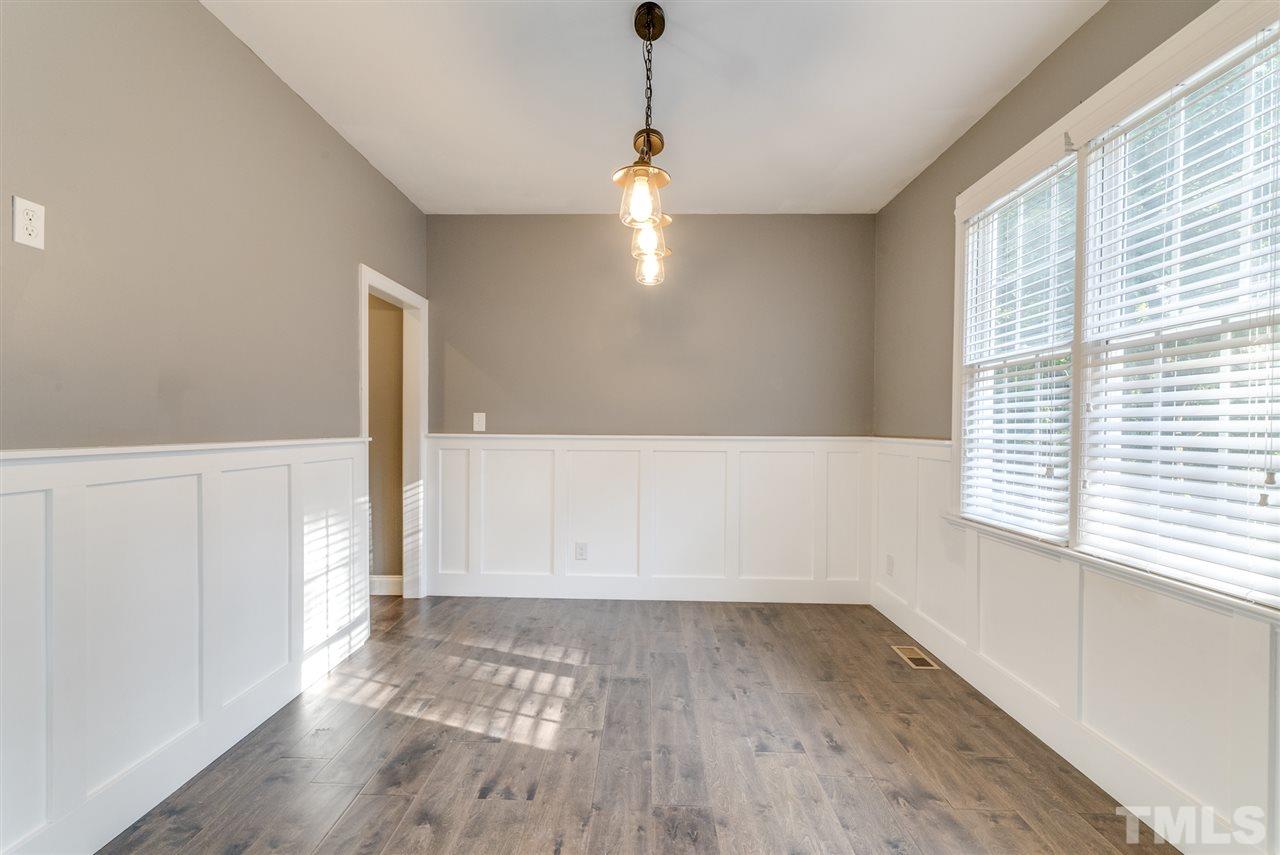 11508 John Allen Road Raleigh, NC 27614 - Photo 12 of 25 a view of an empty room with wooden floor and a window