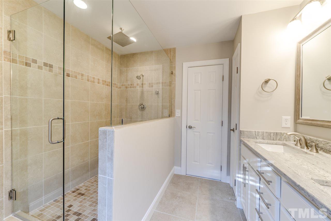 11508 John Allen Road Raleigh, NC 27614 - Photo 15 of 25 a bathroom with a granite countertop sink a shower and a mirror
