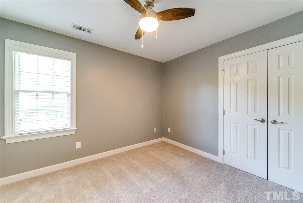 11508 John Allen Road Raleigh, NC 27614 - Photo 17 of 25 an empty room with closet and windows