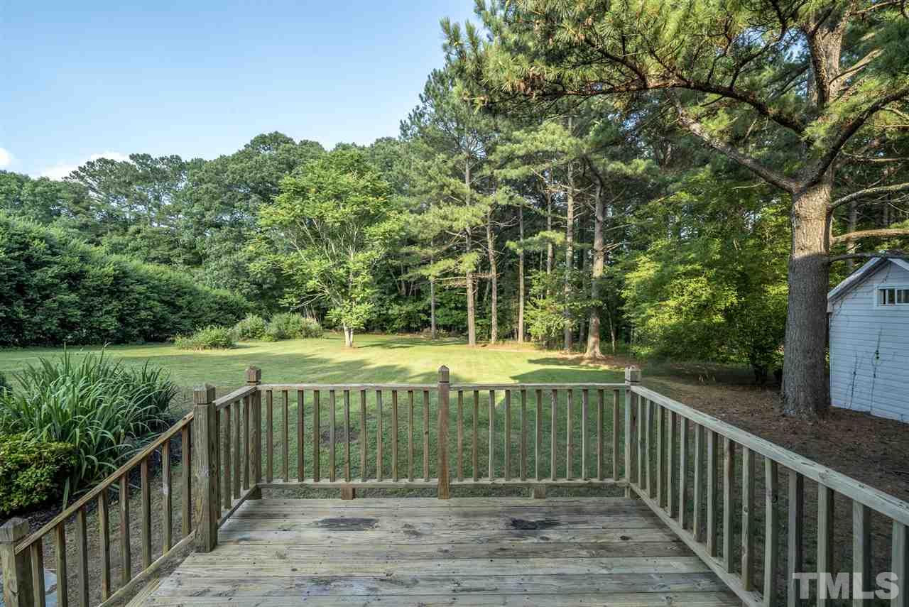 11508 John Allen Road Raleigh, NC 27614 - Photo 22 of 25 a view of balcony with wooden floor and fence