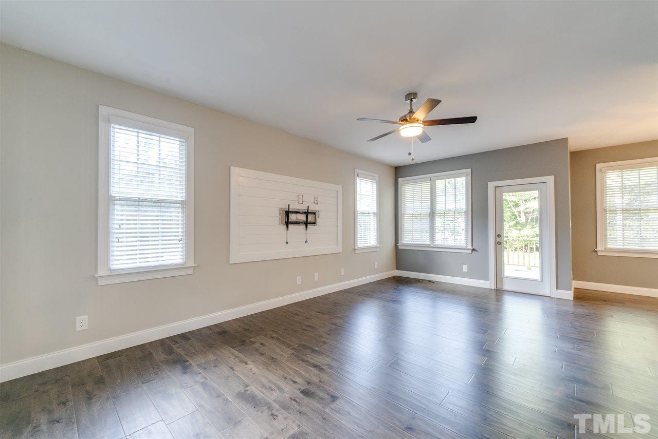 11508 John Allen Road Raleigh, NC 27614 - Photo 4 of 25 an empty room with wooden floor and windows