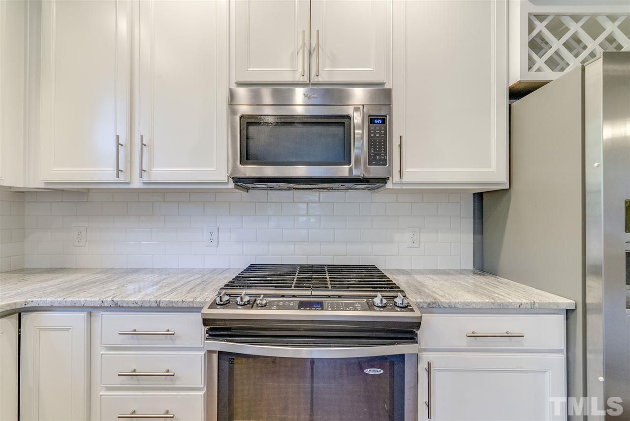 11508 John Allen Road Raleigh, NC 27614 - Photo 9 of 25 a stove top oven sitting inside of a kitchen