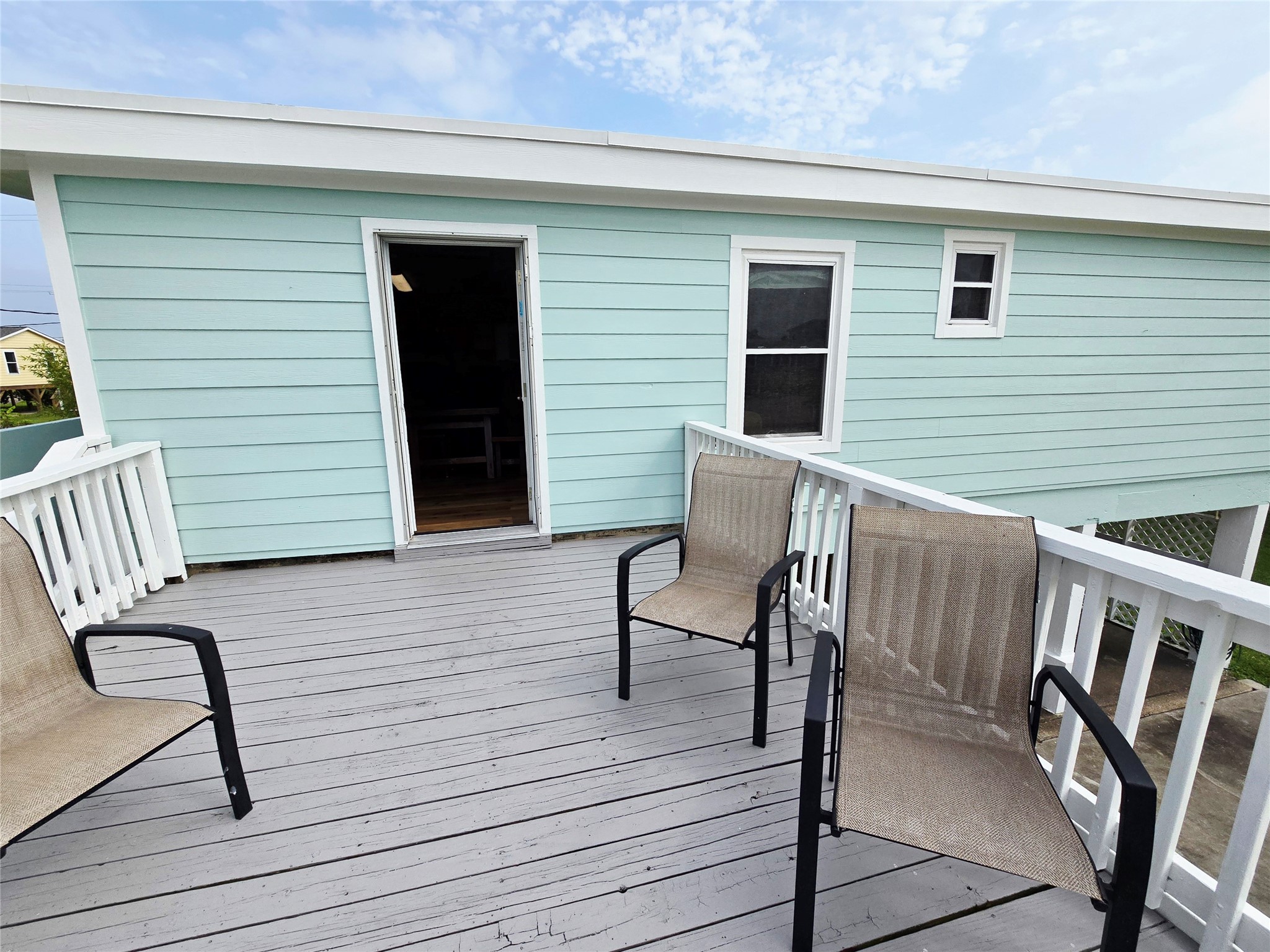 16611 Jolly Roger Road Jamaica Beach, TX 77554 - Photo 13 of 49 a view of deck with furniture