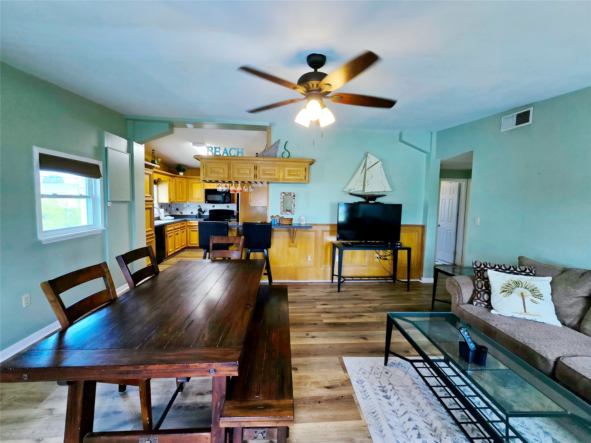 16611 Jolly Roger Road Jamaica Beach, TX 77554 - Photo 16 of 49 a living room with furniture and a chandelier