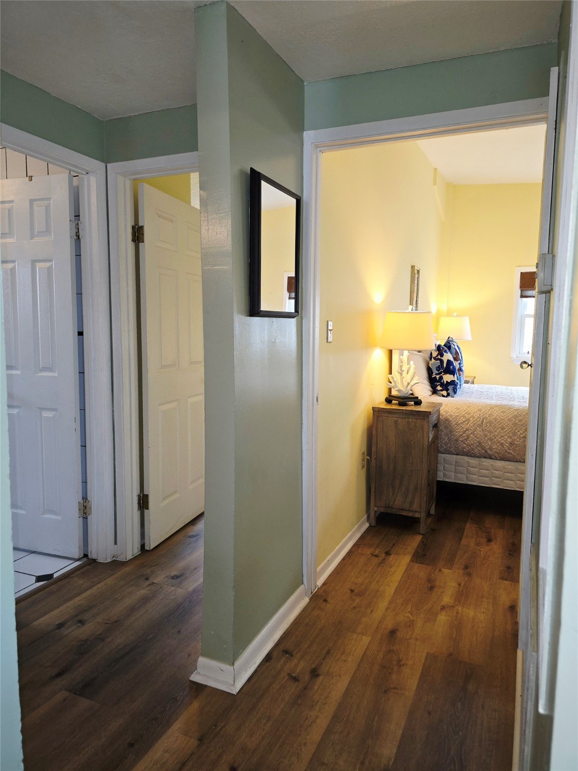 16611 Jolly Roger Road Jamaica Beach, TX 77554 - Photo 20 of 49 a bedroom with a bed and a window