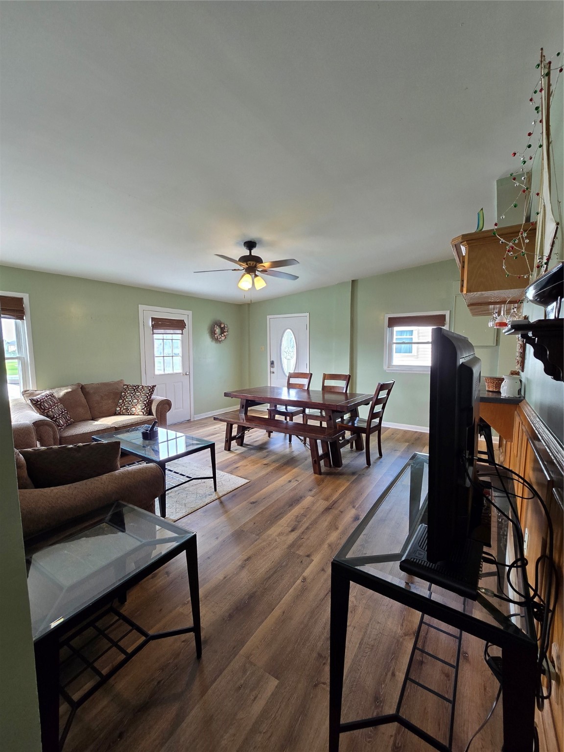 16611 Jolly Roger Road Jamaica Beach, TX 77554 - Photo 21 of 49 a living room with furniture a dining table and chairs