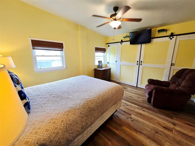 a bathroom with a sink mirror toilet and shower