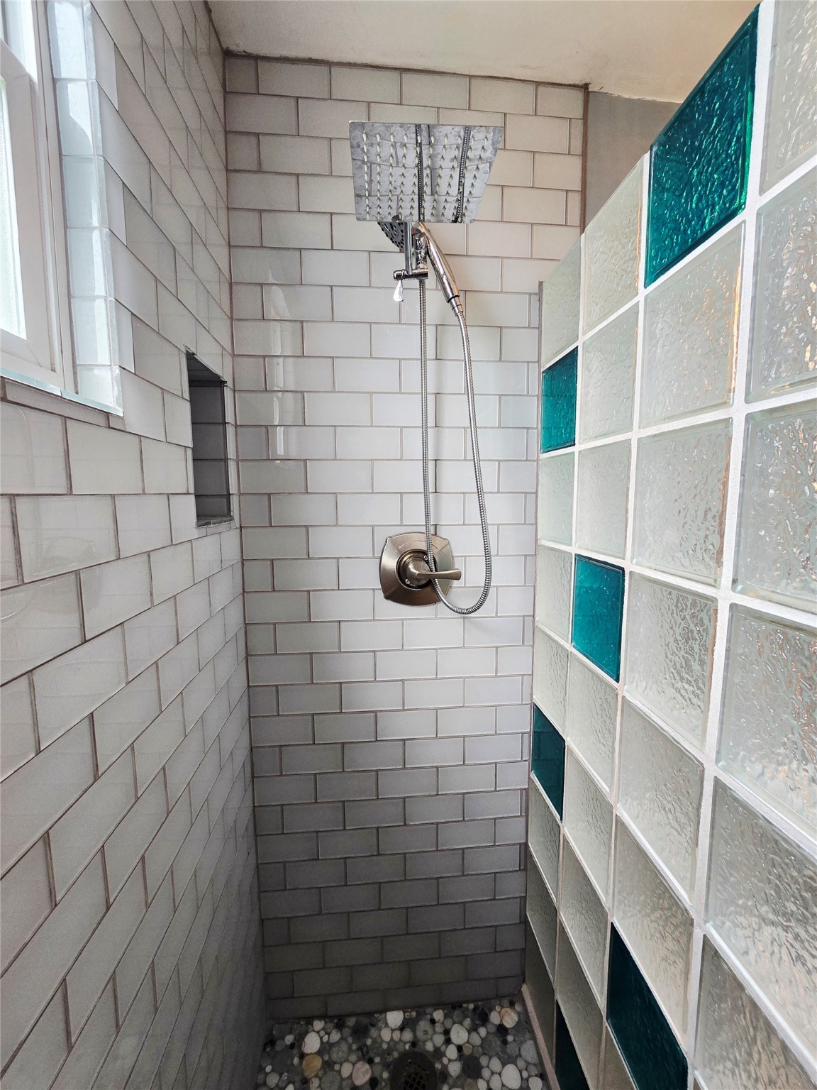 16611 Jolly Roger Road Jamaica Beach, TX 77554 - Photo 26 of 49 a bathroom with a shower