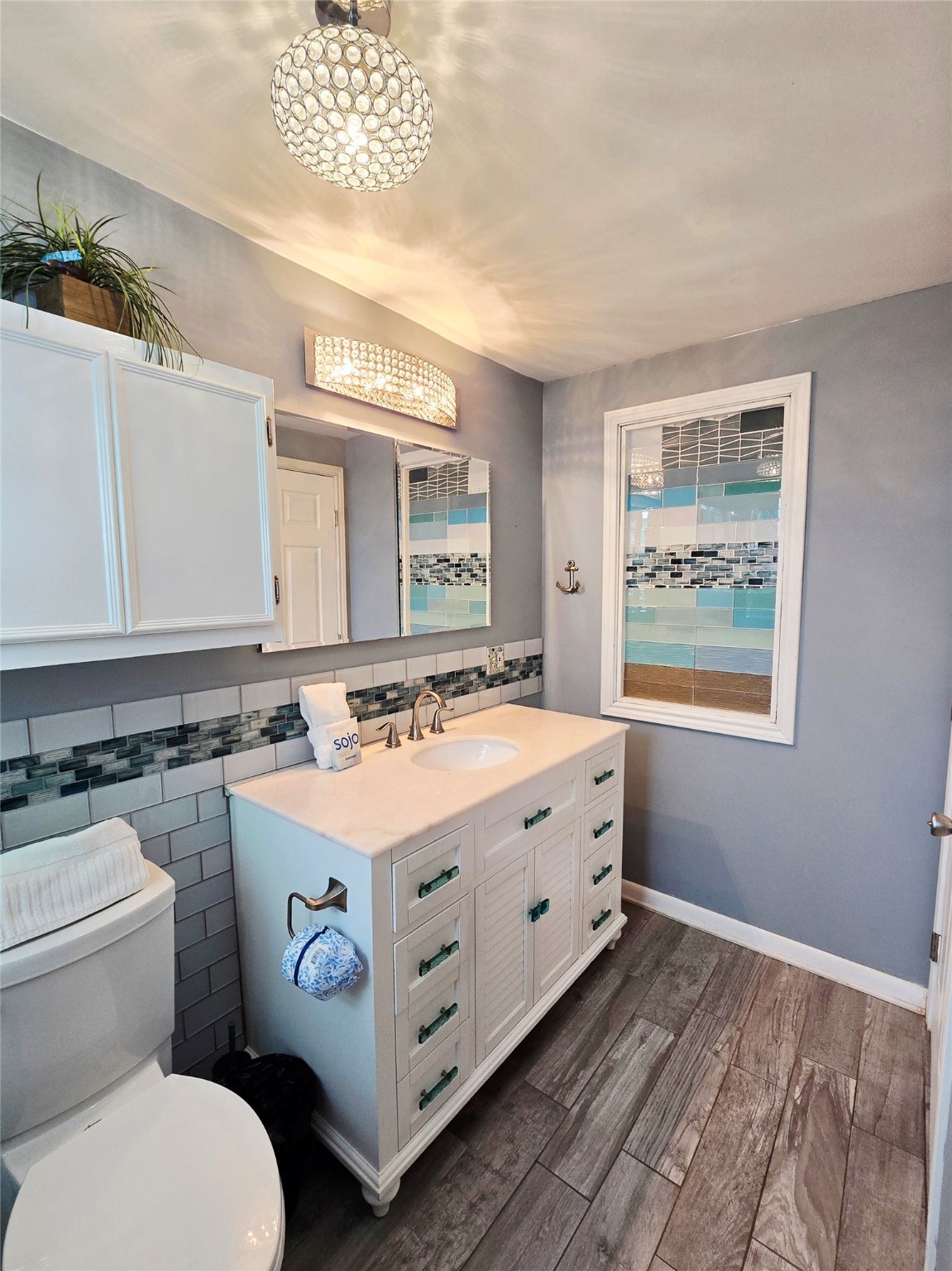 16611 Jolly Roger Road Jamaica Beach, TX 77554 - Photo 27 of 49 a bathroom with a sink and a mirror