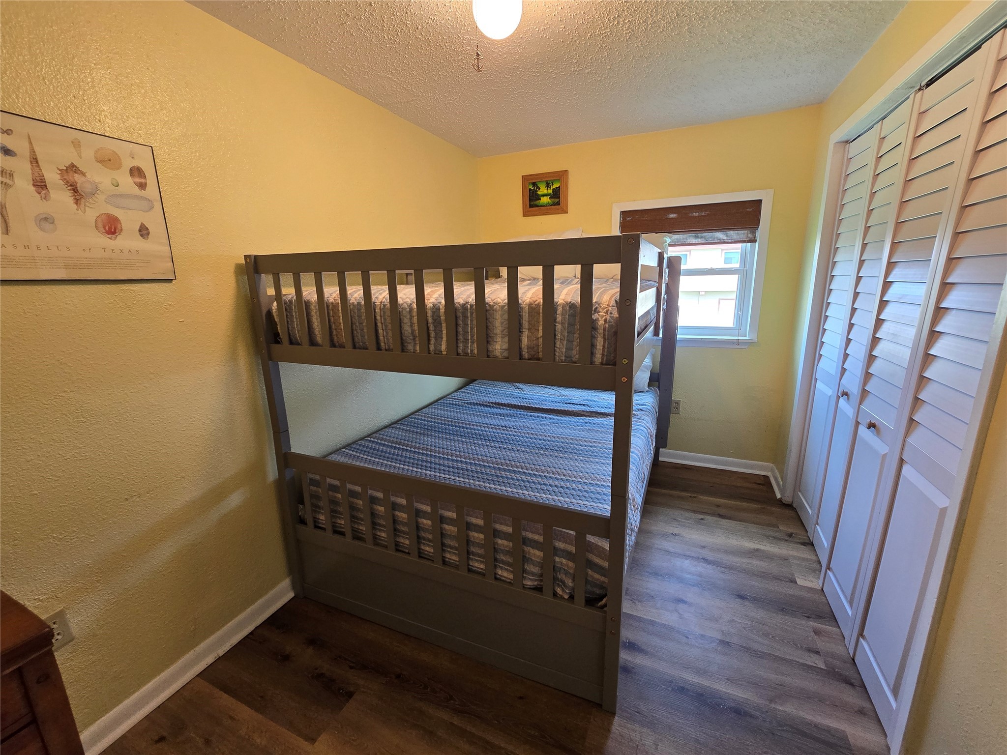 16611 Jolly Roger Road Jamaica Beach, TX 77554 - Photo 36 of 49 a view of a hallway with wooden floor and stairs