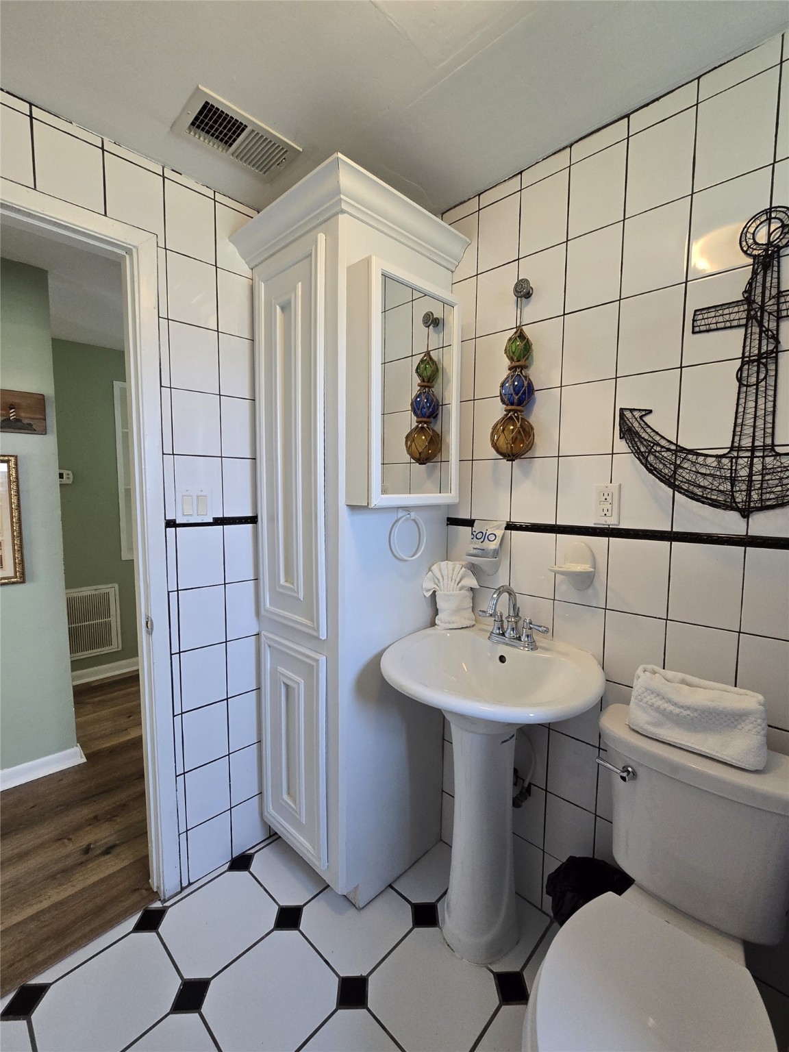 16611 Jolly Roger Road Jamaica Beach, TX 77554 - Photo 40 of 49 a bathroom with a sink toilet and shower