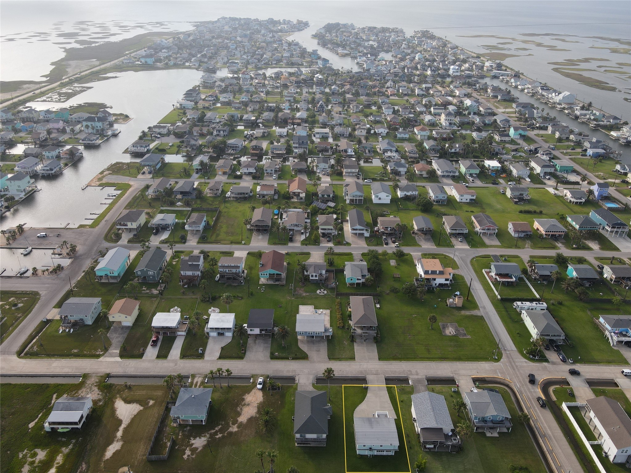 16611 Jolly Roger Road Jamaica Beach, TX 77554 - Photo 48 of 49 an aerial view of residential houses with outdoor space
