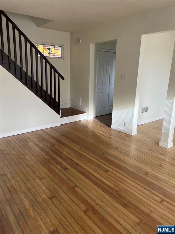 263 Sutton Avenue Hackensack, NJ 07601 - Photo 2 of 11 a view of a hallway with wooden floor