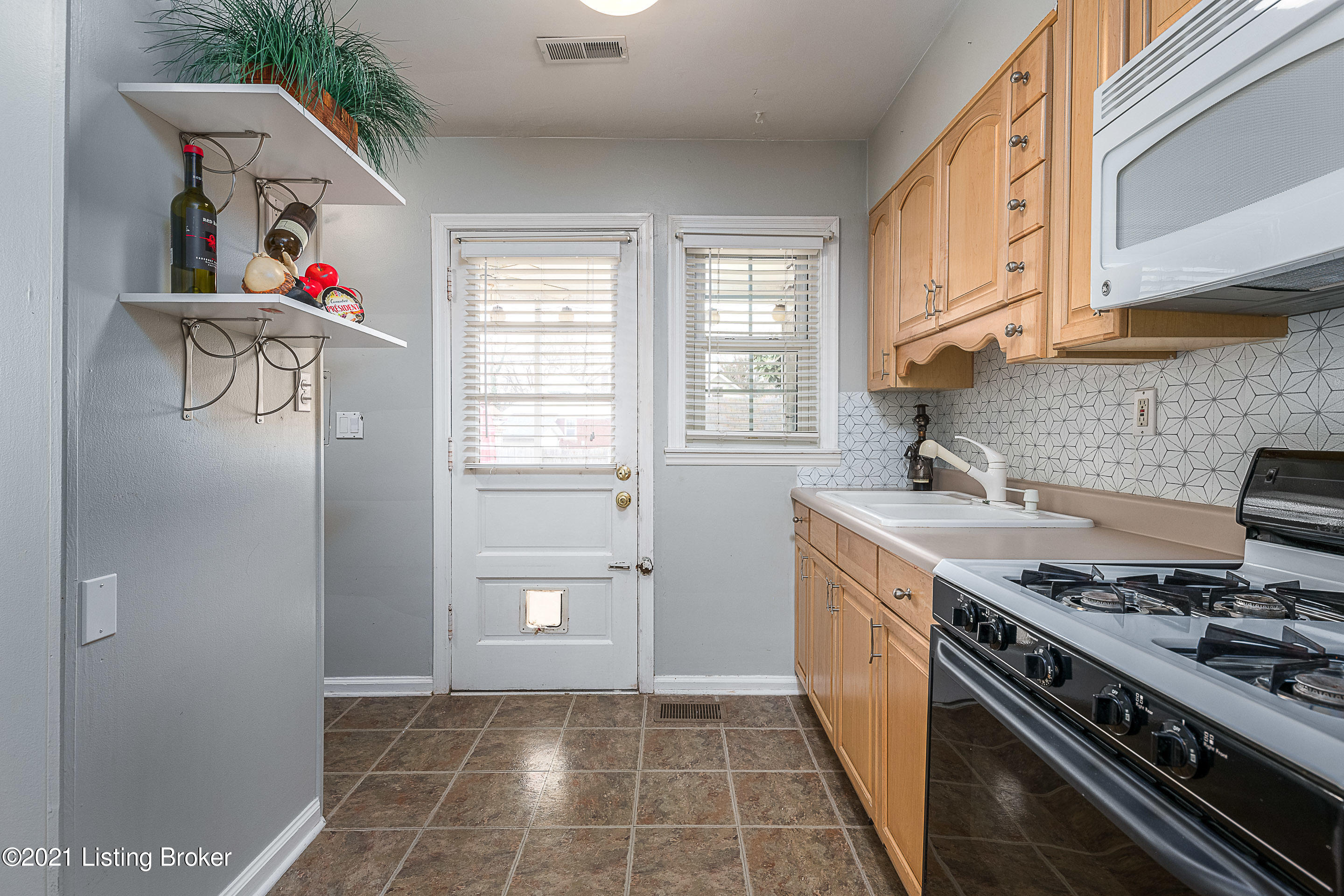 2500 Sherry Road Louisville, KY 40217 - Photo 11 of 28 KITCHEN VIEW TOWARDS THE BACK DOOR & LAUNDRY AREA.