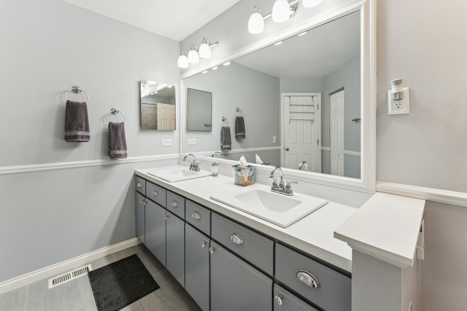 159 West Hamilton Drive Palatine, IL 60067 - Photo 15 of 24 a bathroom with a sink a double vanity and a mirror