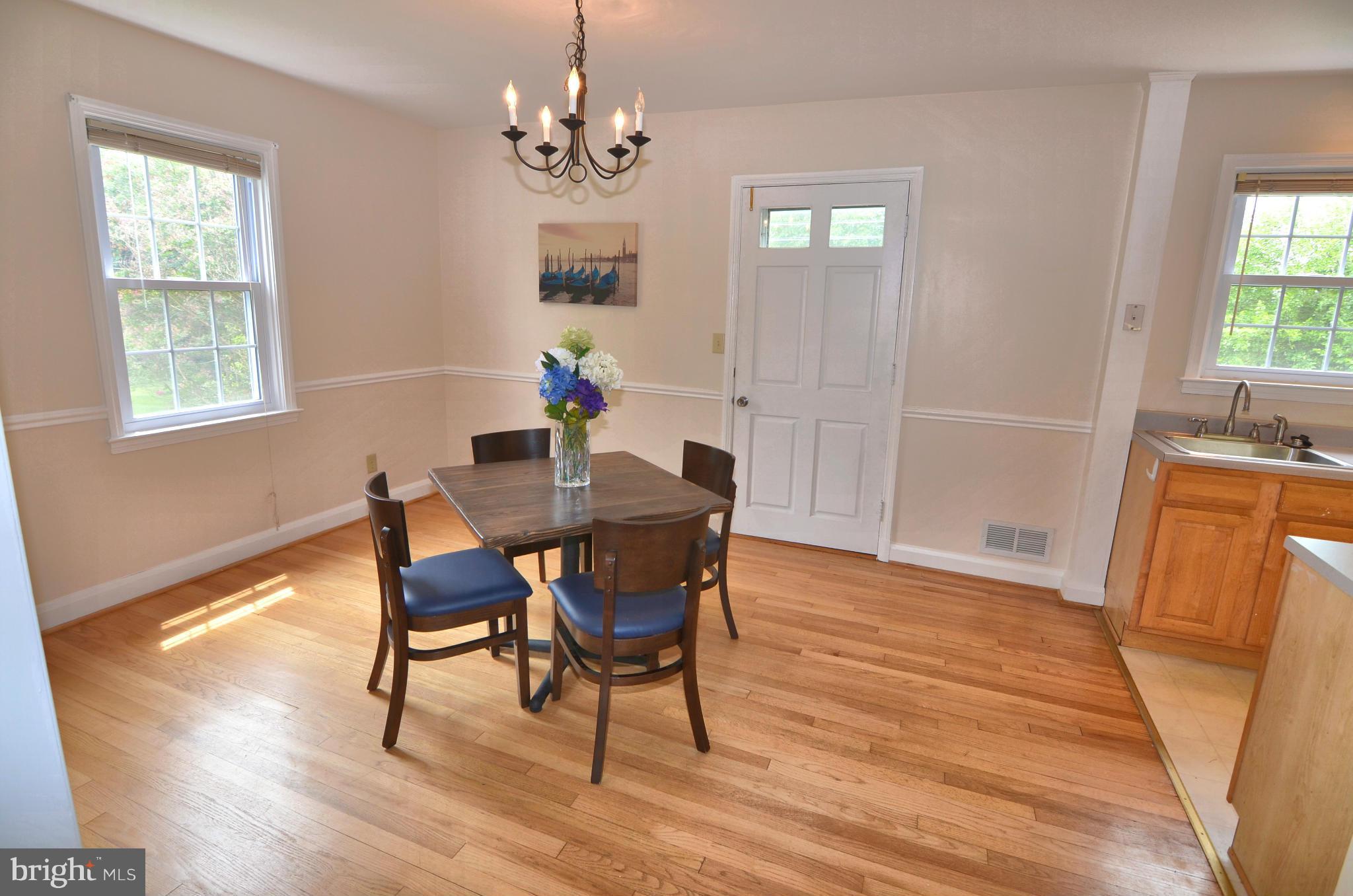 904 Locustvale Road Towson, MD 21204 - Photo 3 of 15 DR open to Kit with door to Deck