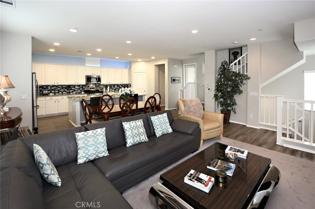 443 Stratus Lane, Unit 4 Simi Valley, CA 93065 - Photo 11 of 32 a living room with furniture and a large window