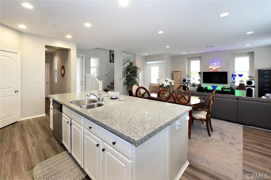 443 Stratus Lane, Unit 4 Simi Valley, CA 93065 - Photo 17 of 32 a kitchen with stainless steel appliances granite countertop a kitchen island a stove and a sink