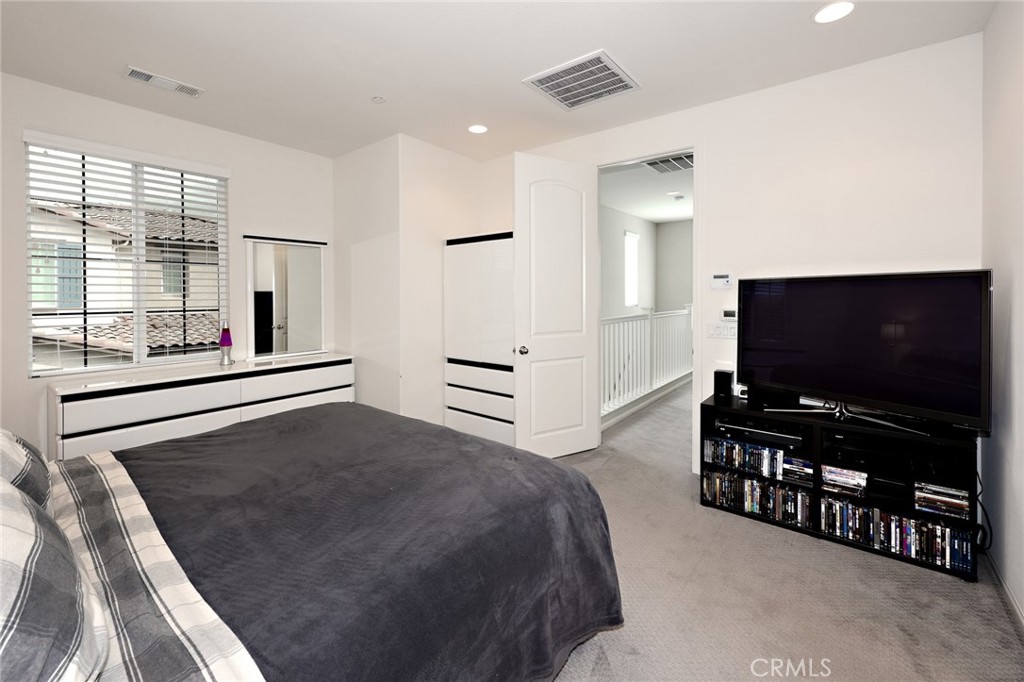 443 Stratus Lane, Unit 4 Simi Valley, CA 93065 - Photo 21 of 32 a living room with furniture and a flat screen tv