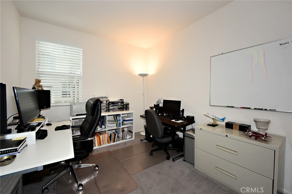 443 Stratus Lane, Unit 4 Simi Valley, CA 93065 - Photo 29 of 32 a view of a workspace with furniture and a window