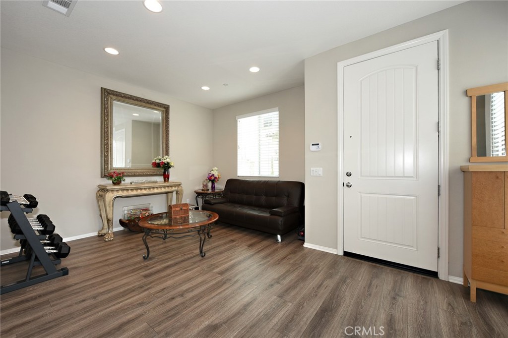 443 Stratus Lane, Unit 4 Simi Valley, CA 93065 - Photo 5 of 32 a living room with furniture and a wooden floor