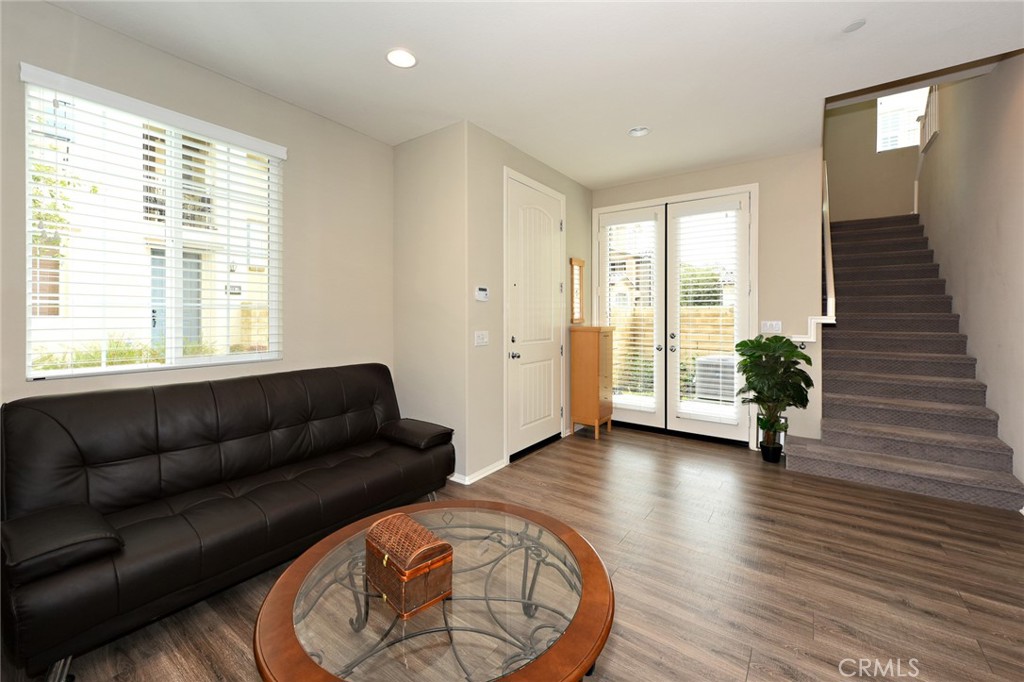 443 Stratus Lane, Unit 4 Simi Valley, CA 93065 - Photo 6 of 32 a living room with furniture and a wooden floor