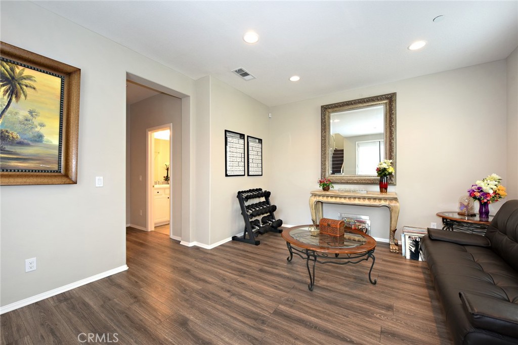 443 Stratus Lane, Unit 4 Simi Valley, CA 93065 - Photo 7 of 32 a living room with furniture and a wooden floor