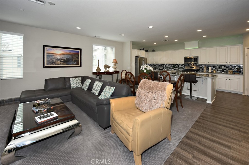 443 Stratus Lane, Unit 4 Simi Valley, CA 93065 - Photo 8 of 32 a living room with furniture and a wooden floor