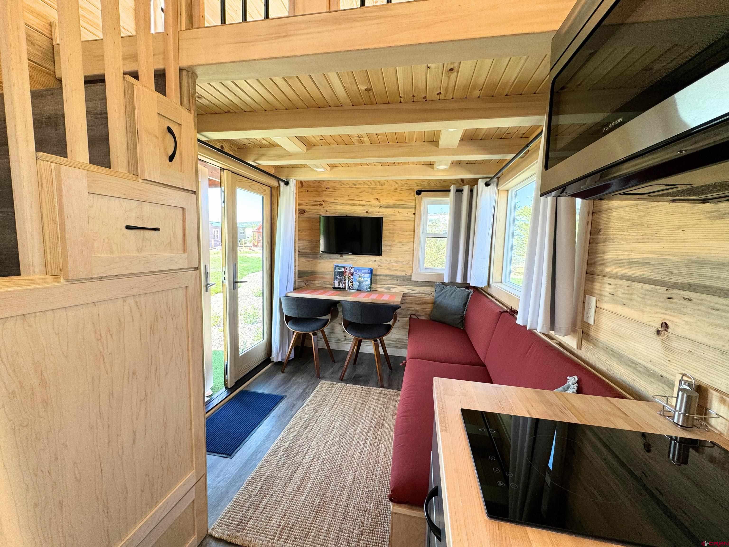 22130 6850 Road, Unit 211 Montrose, CO 81403 - Photo 13 of 25 a outdoor living space with furniture and a fireplace