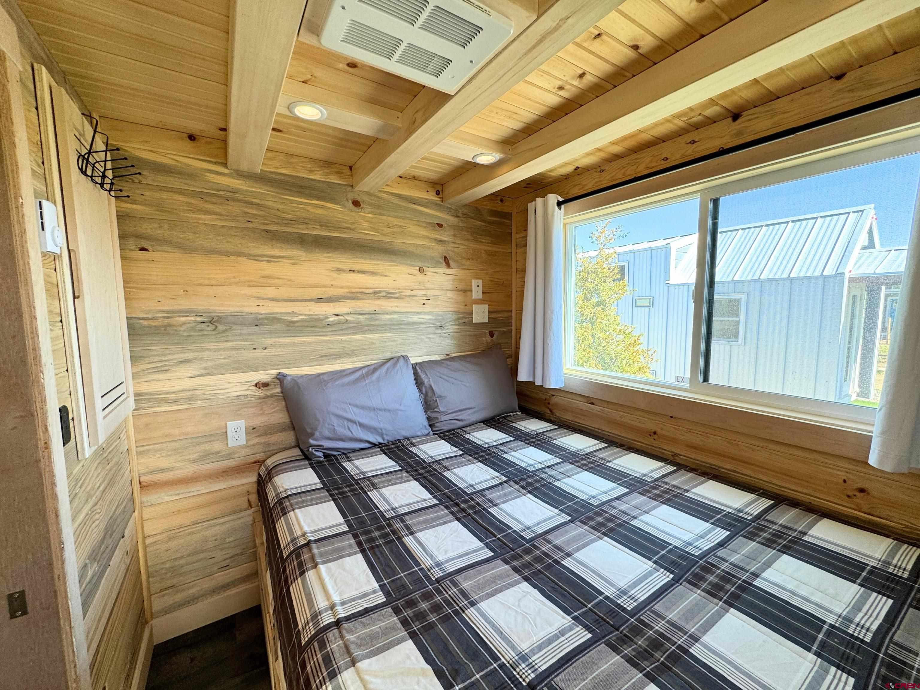 22130 6850 Road, Unit 211 Montrose, CO 81403 - Photo 9 of 25 a view of a balcony with chair