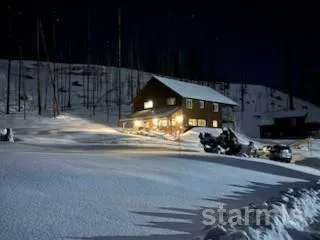 a view of a garage with parked cars