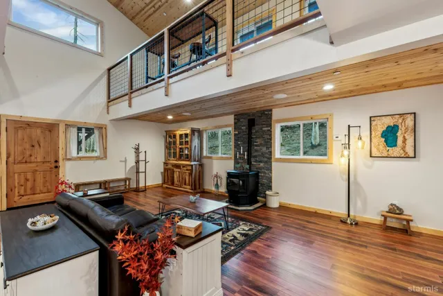 a living room with furniture pool table and window