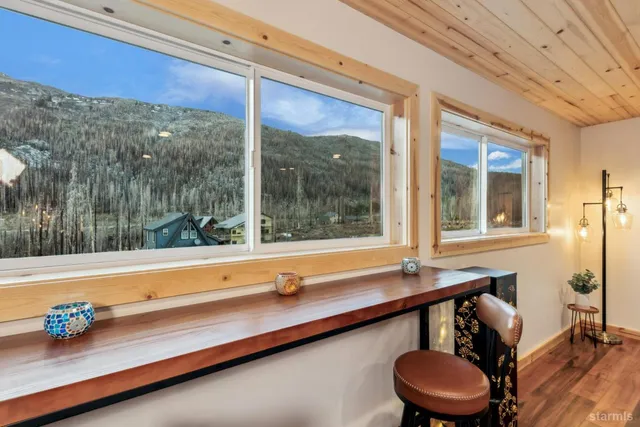 a kitchen with a sink and a large window