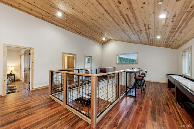 a view of a livingroom with furniture wooden floor and window