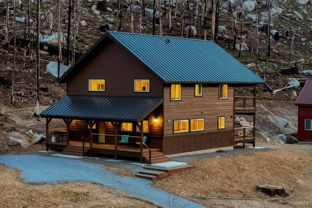 a view of a house with roof and sitting area
