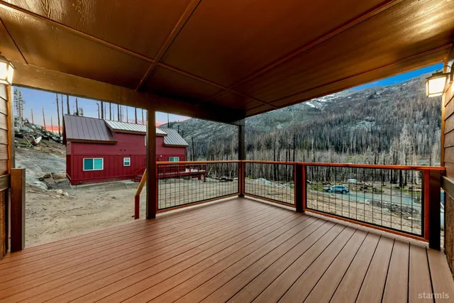 a view of a balcony with wooden floor