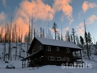 a living room with lots of furniture wooden floor and rug
