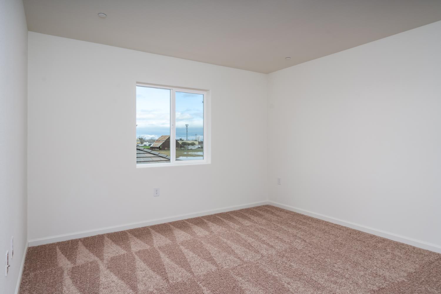 2259 Travis Court Newman, CA 95360 - Photo 9 of 17 an empty room with a window