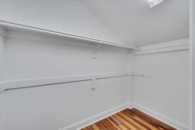 a view of a brick house with a large window