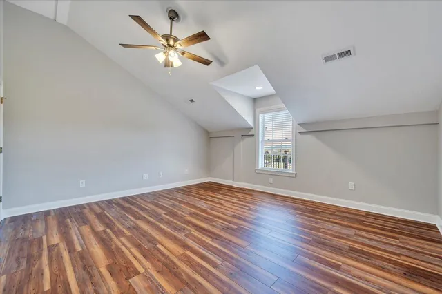 a view of a hallway with wooden shelves