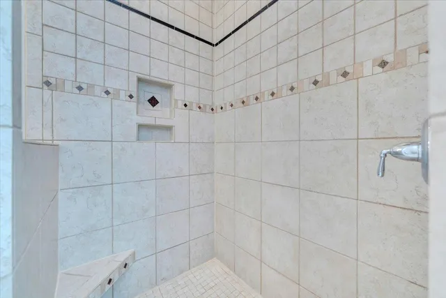 a view of a room with wooden floor and fence