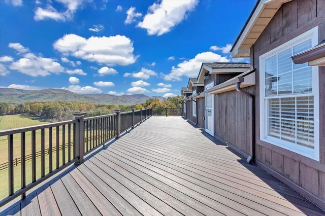 a view of a big room with table and chairs