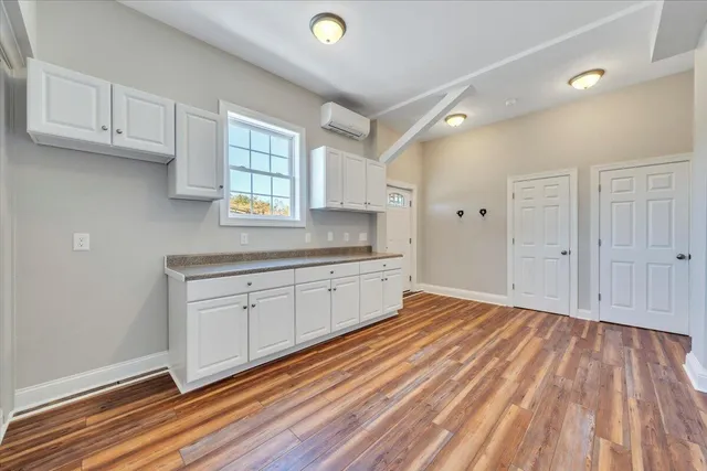 a view of a yard with large trees