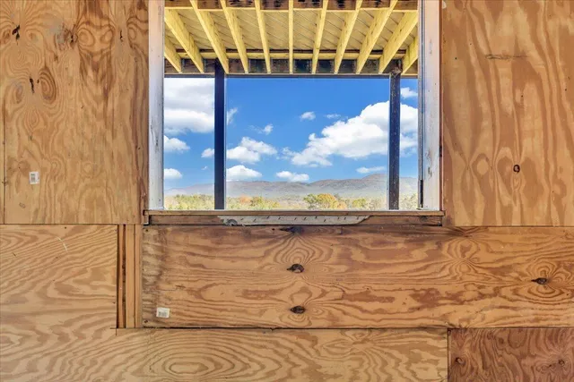 a roof deck with table and chairs